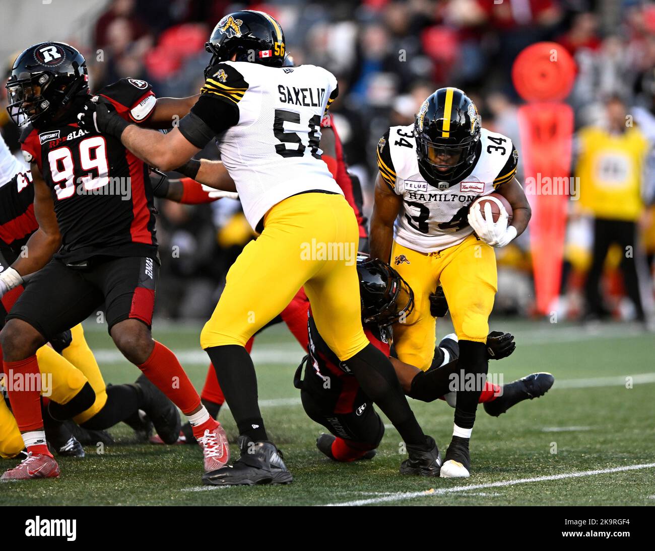 Canada. 29th Oct, 2022. Hamilton Tiger-Cats' Wes Hills (34) tries to make  his way past the Ottawa Redblacks defence during first half CFL football  action in Ottawa on Saturday, Oct. 29, 2022.