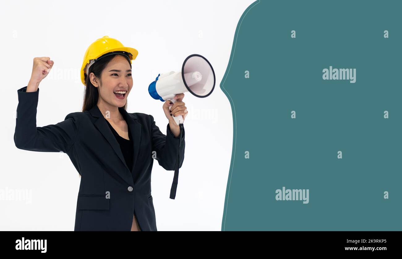 Asian woman holding a megaphone shouting loud with curly bracket space. Stock Photo