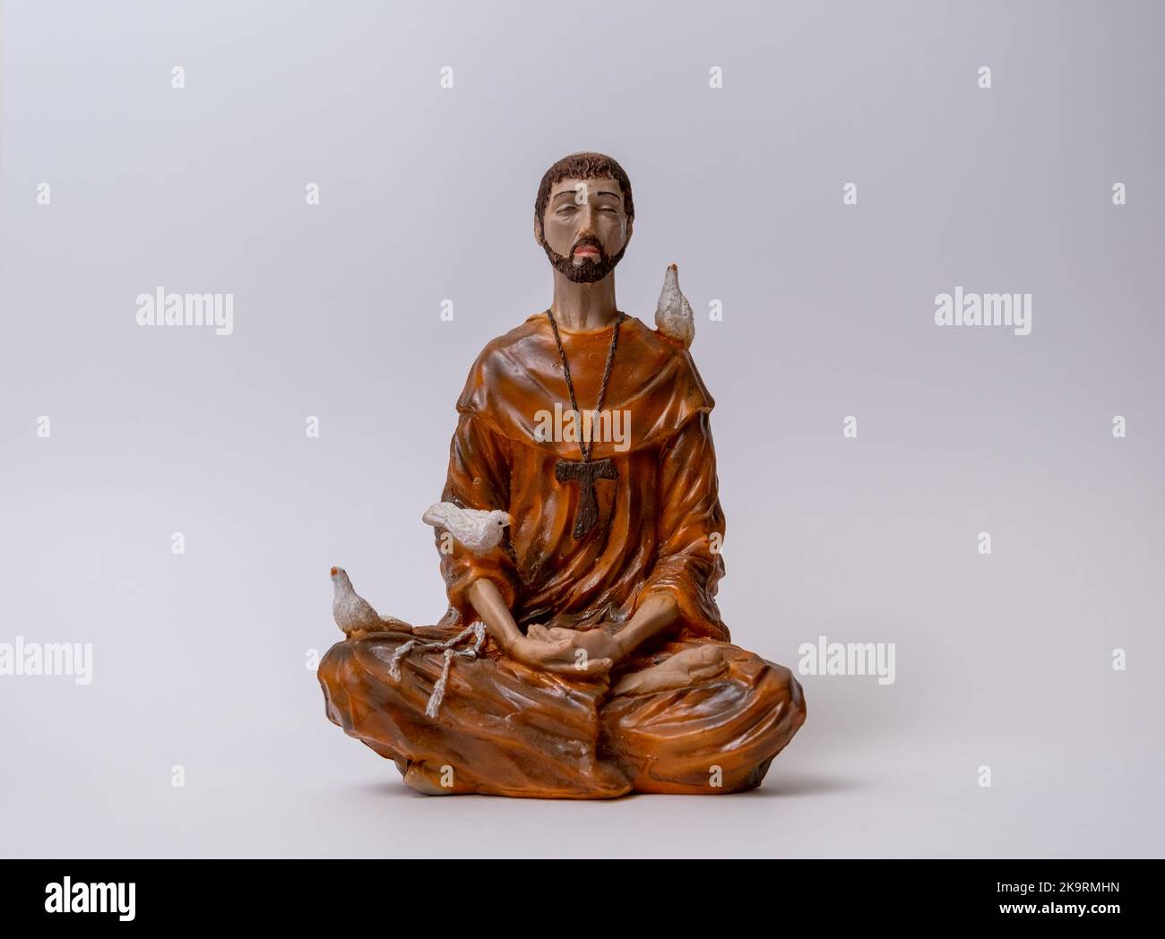 Statuette of Saint Francis of Assisi meditating in the position called