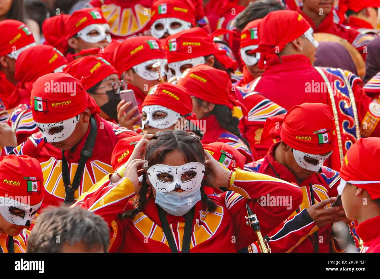 Mexico City, Mexico. 29th Oct, 2022. A marching band adjusts their costumes before marching in the Grand Parade of the Dead to celebrate Dia de los Muertos holiday on Paseo de la Reforma, October 29, 2022 in Mexico City, Mexico. Credit: Richard Ellis/Richard Ellis/Alamy Live News Stock Photo