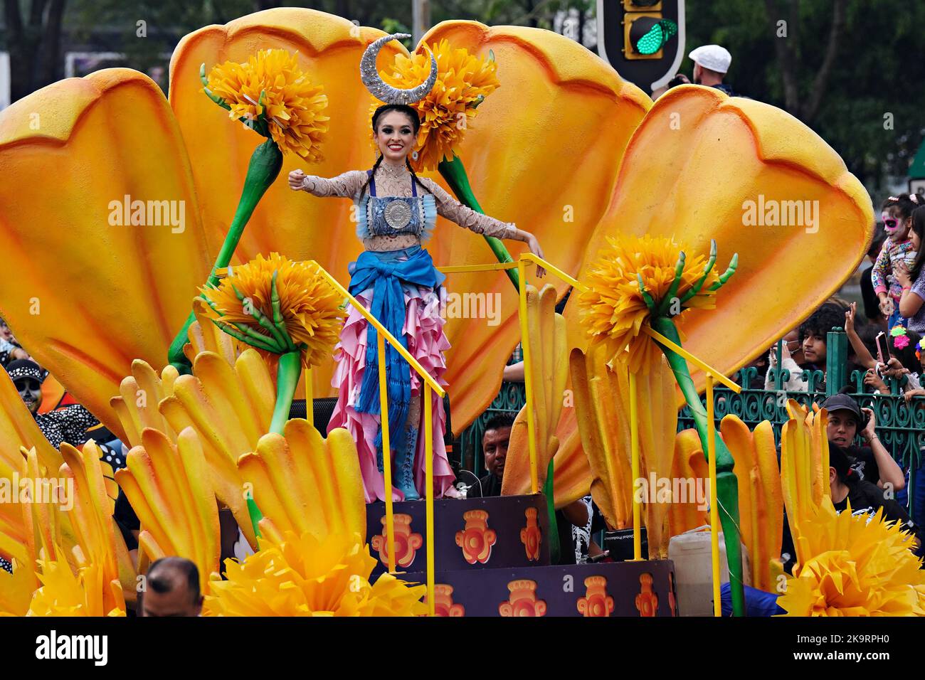 Mexico City, Mexico. 29th Oct, 2022. The Beauty Queen rides in a parade float of giant marigolds during the Grand Parade of the Dead to celebrate Dia de los Muertos holiday on Paseo de la Reforma, October 29, 2022 in Mexico City, Mexico. Credit: Richard Ellis/Richard Ellis/Alamy Live News Stock Photo