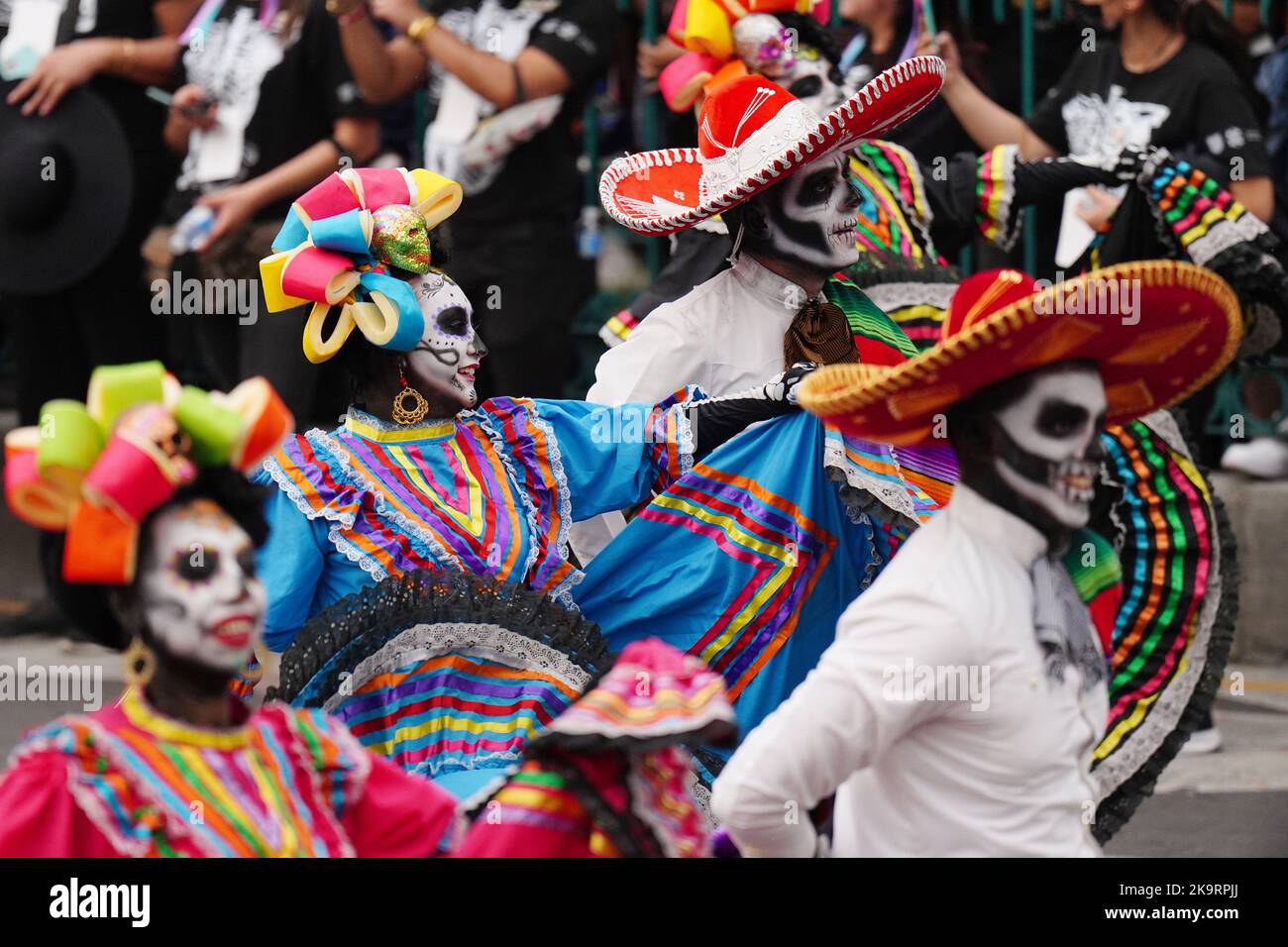 Mexico City, Mexico. 29th Oct, 2022. Performers wearing traditional Mexican costumes and skeleton face paint dance down the street during the Grand Parade of the Dead to celebrate Dia de los Muertos holiday on Paseo de la Reforma, October 29, 2022 in Mexico City, Mexico. Credit: Richard Ellis/Richard Ellis/Alamy Live News Stock Photo
