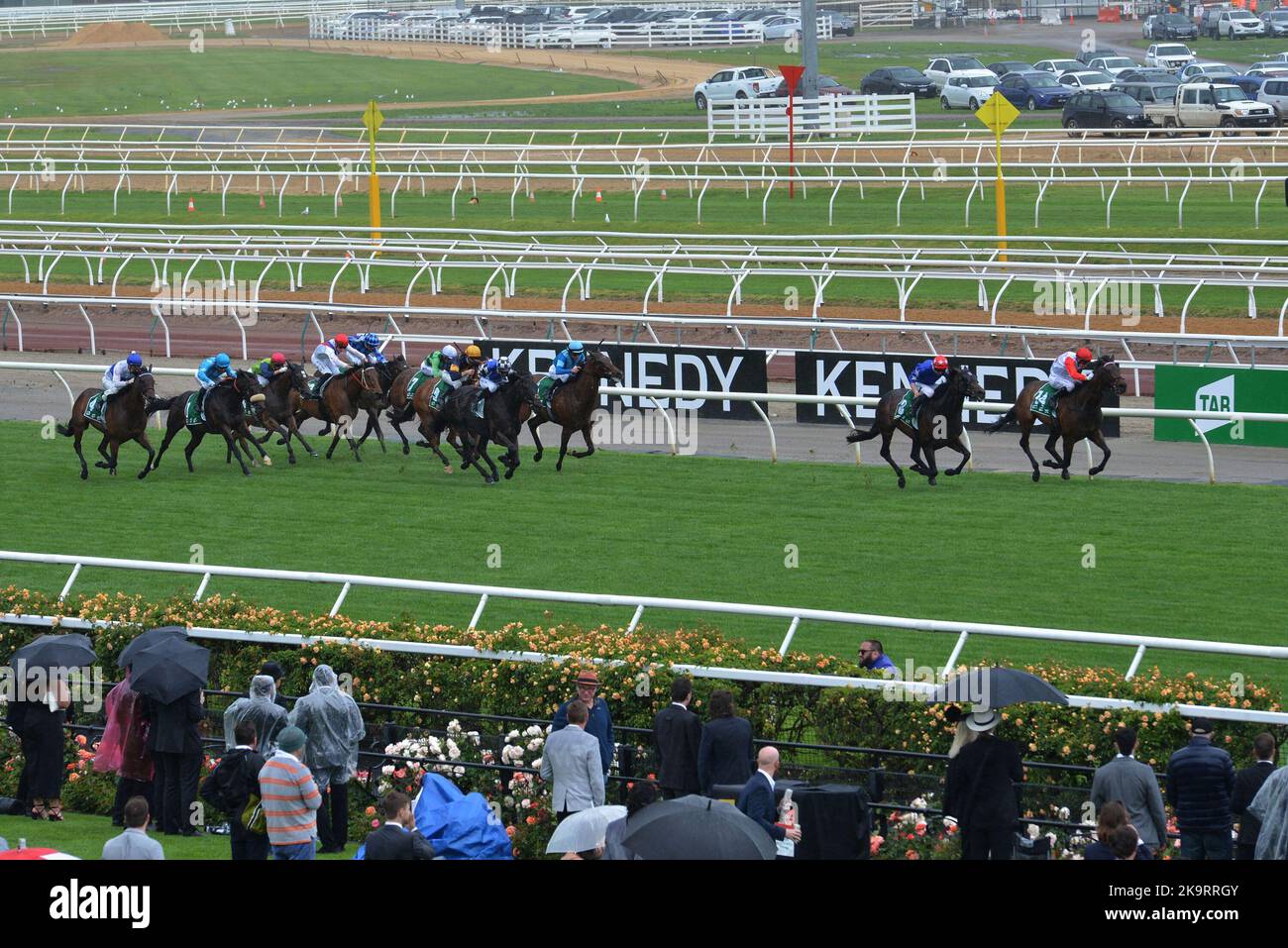 Jockeys and people take part during Melbourne Cup Carnival 2022 at