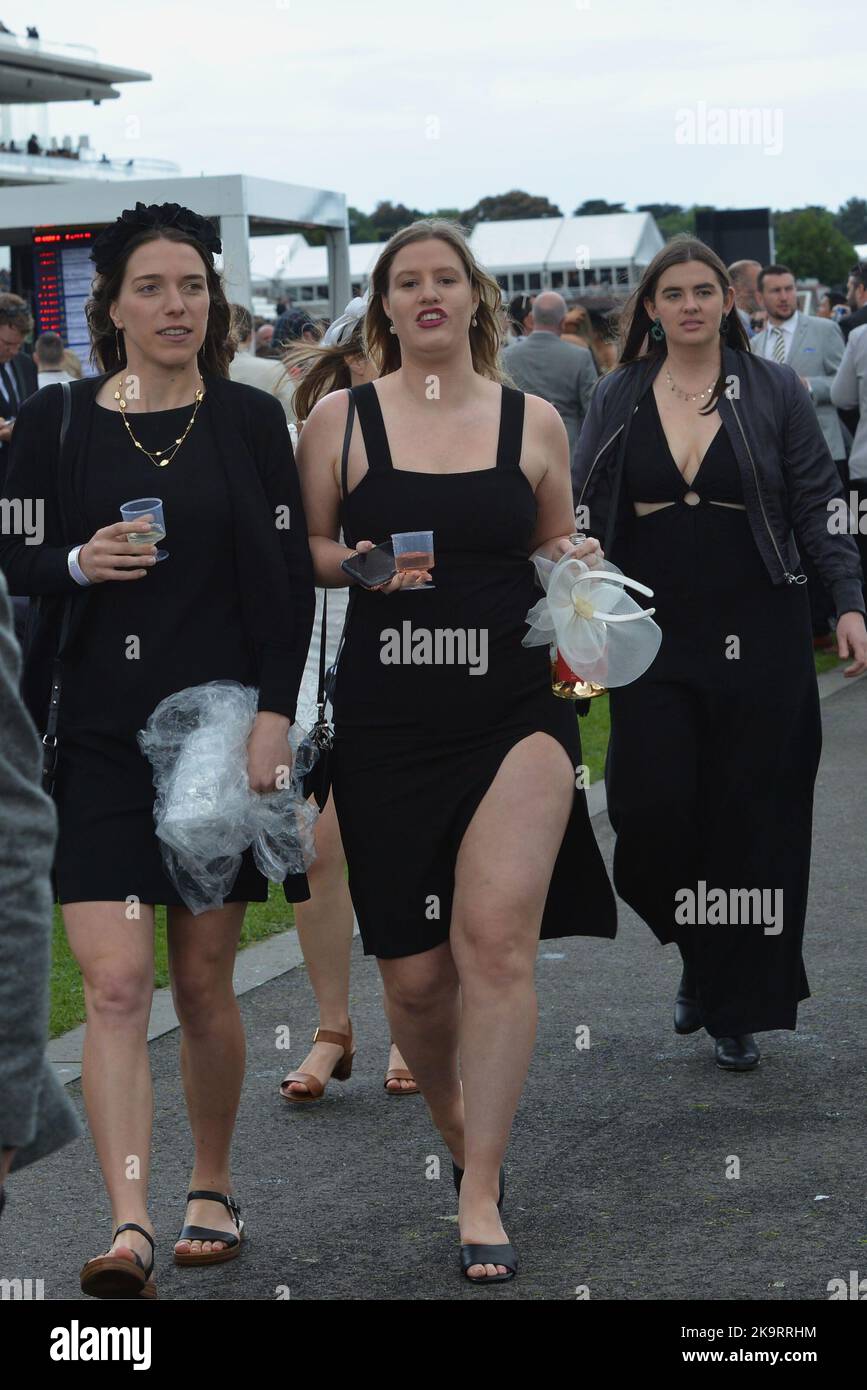Jockeys and people take part during Melbourne Cup Carnival 2022 at