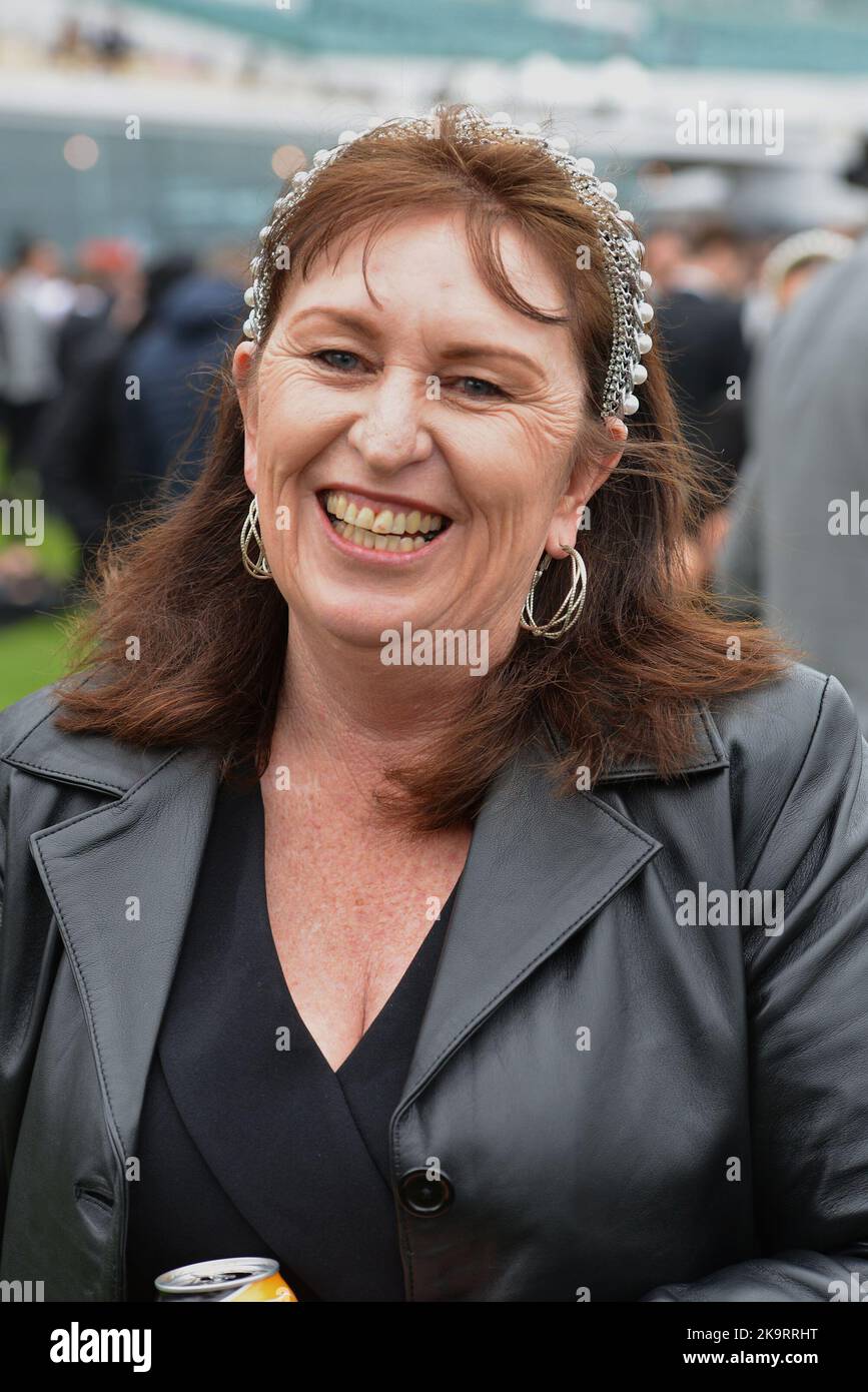 Jockeys and people take part during Melbourne Cup Carnival 2022 at