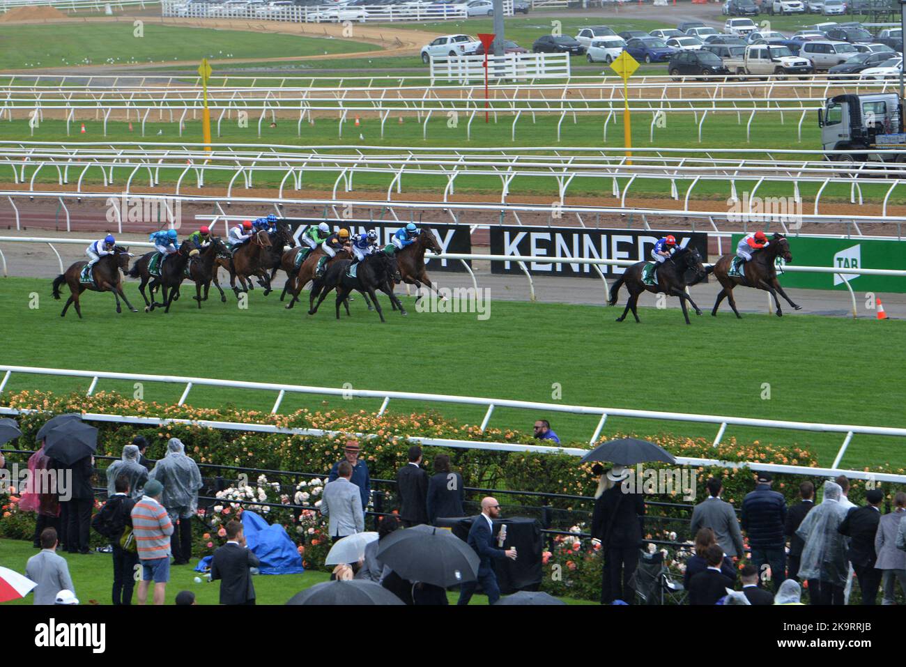 Jockeys and people take part during Melbourne Cup Carnival 2022 at