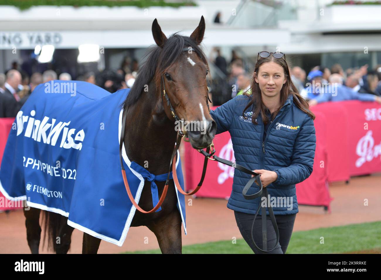 Jockeys and people take part during Melbourne Cup Carnival 2022 at