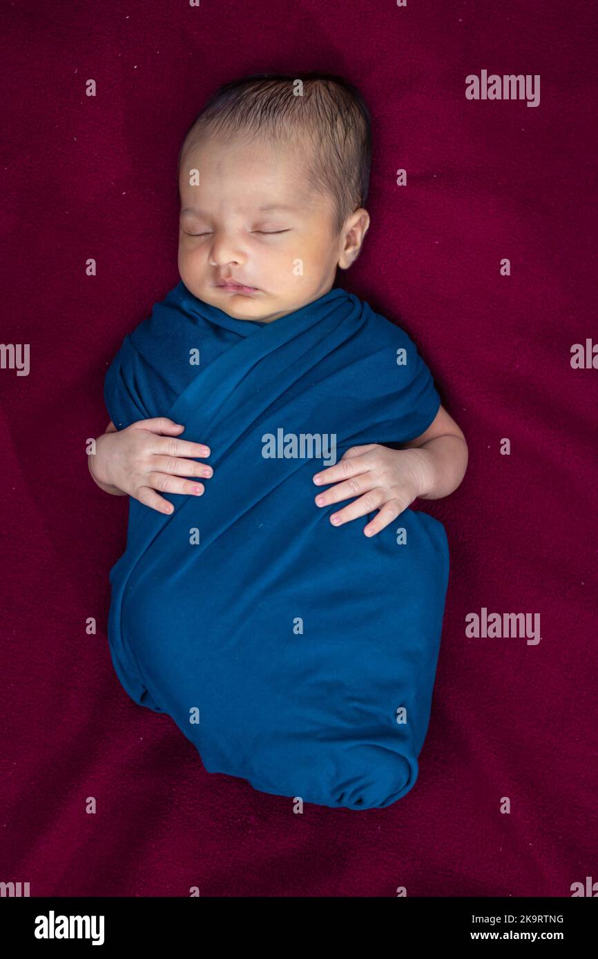 cute newborn baby sleeping in baby wrap top angle shot Stock Photo Alamy