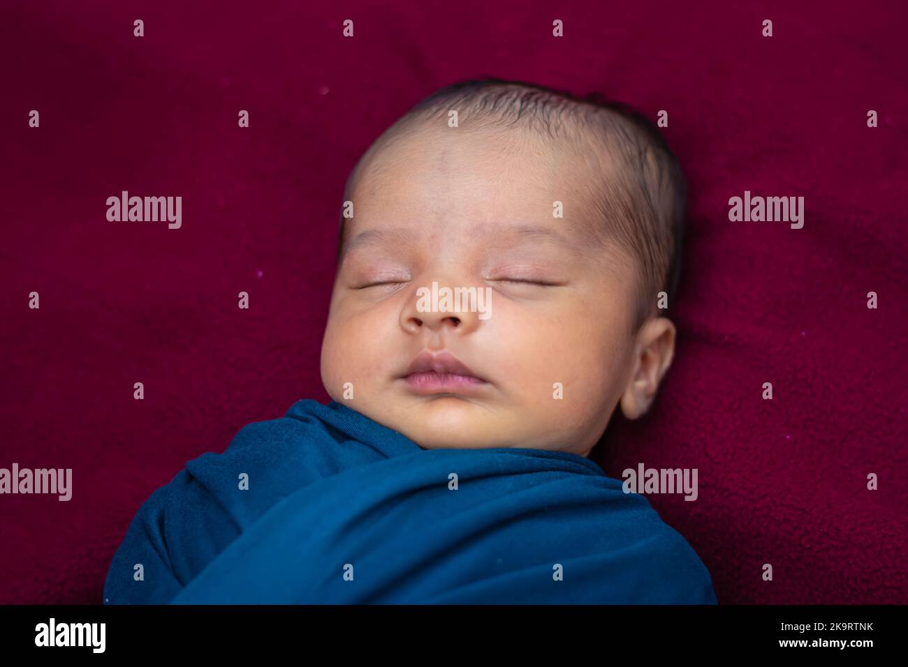 cute newborn baby sleeping in baby wrap top angle shot Stock Photo Alamy