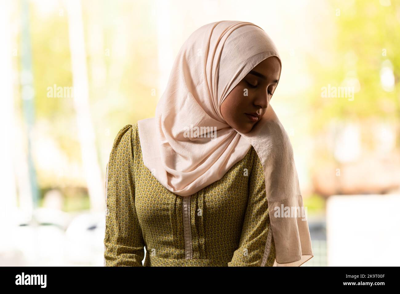 Muslim Woman in Beige Hijab and Traditional Clothes Praying for Allah
