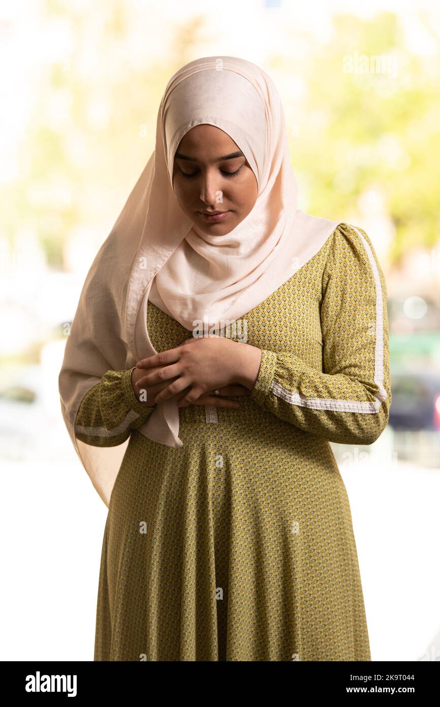 Beautiful Muslim Woman in Hijab Dress in Mosque and Praying Stock Photo 