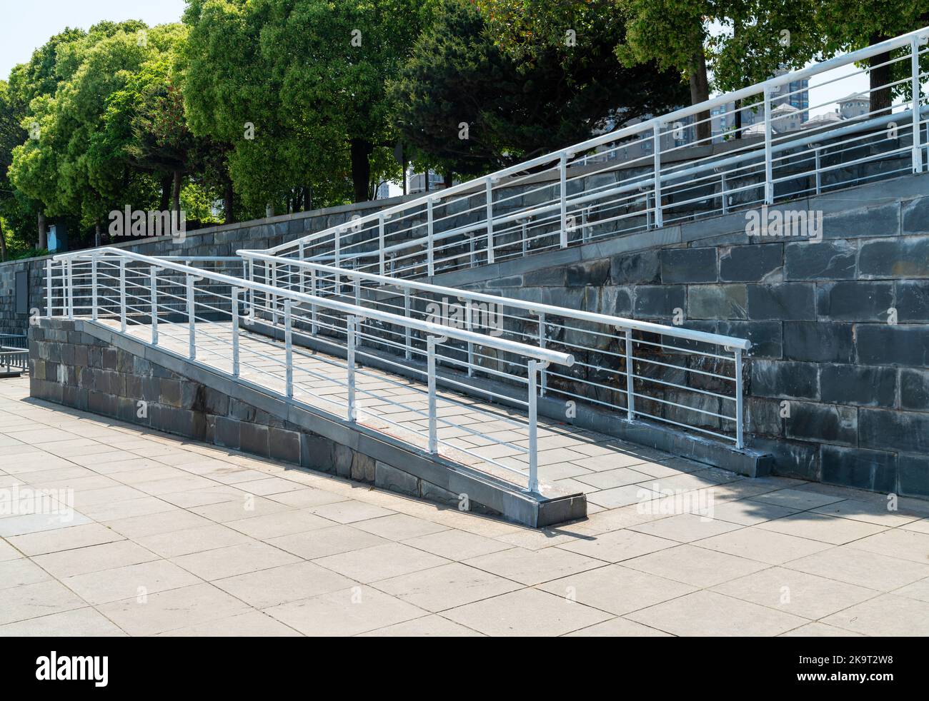 A wheelchair ramp, an inclined plane installed in addition to or