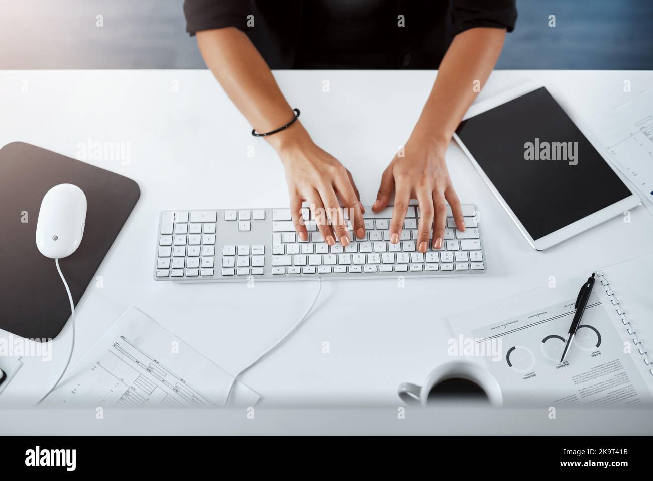Success comes down to how hard you work for it. Cropped sigh angle shot of a businesswoman using a computer at her desk in a modern office. Stock Photo