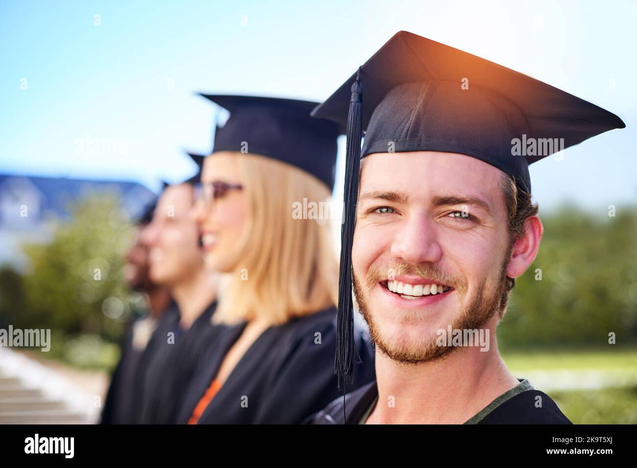 Im on my way to that first million. Defocused shot of students on ...