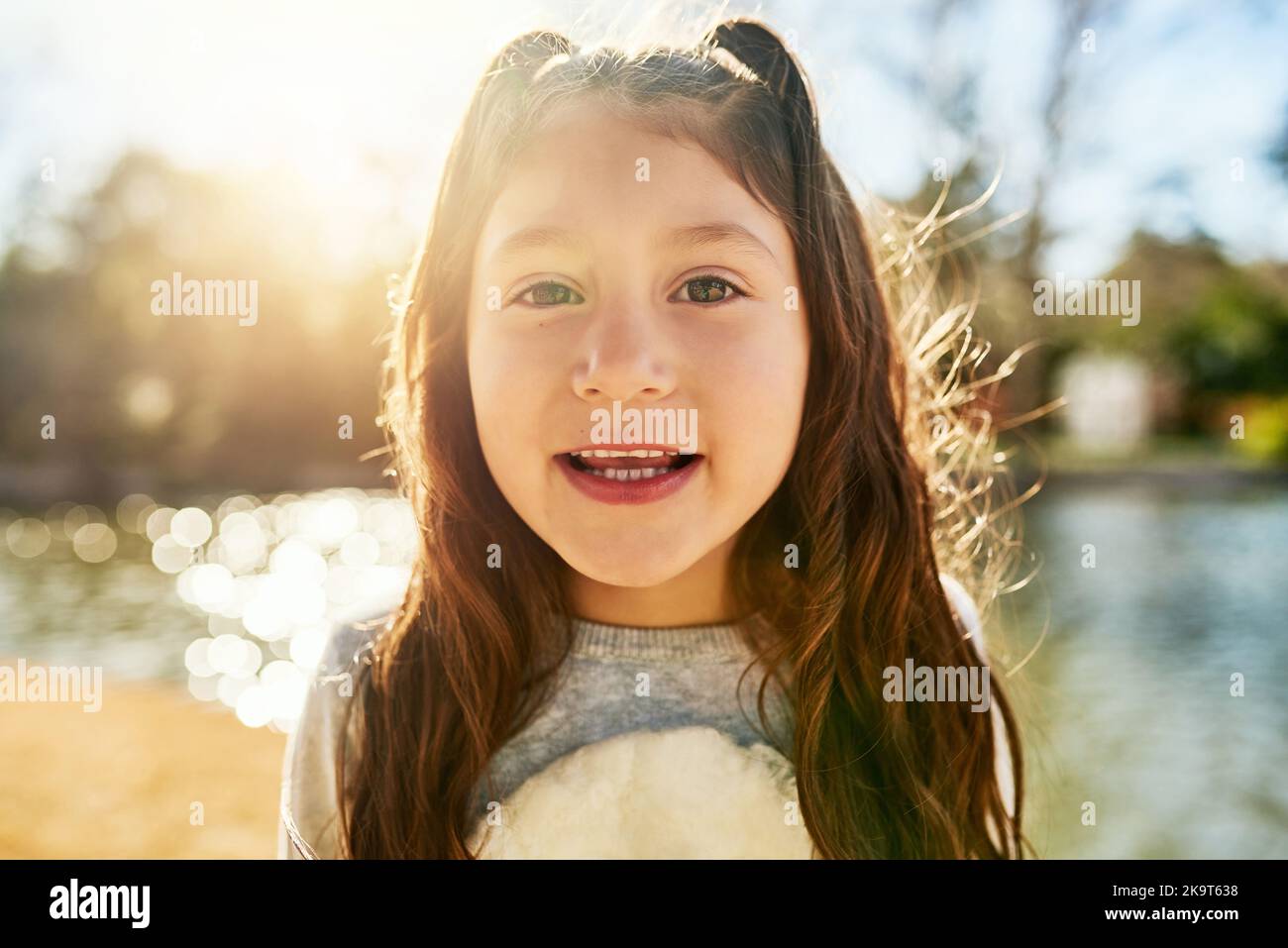 Having some sweet fun in the sun. Portrait of an adorable little girl