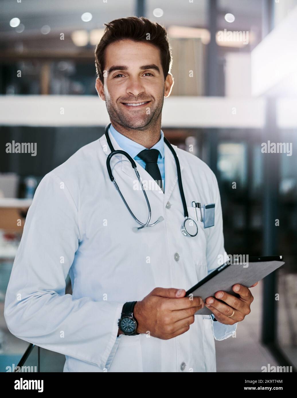 Young handsome male doctor in hi-res stock photography and images - Alamy