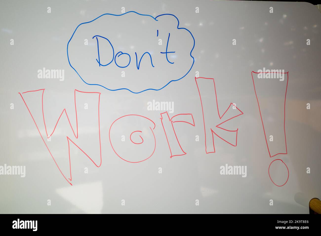on a whiteboard are written the words Don't Work ! Stock Photo Alamy