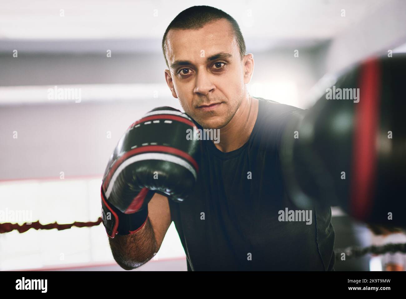 Rolling with the punches. Portrait of a confident young male boxer