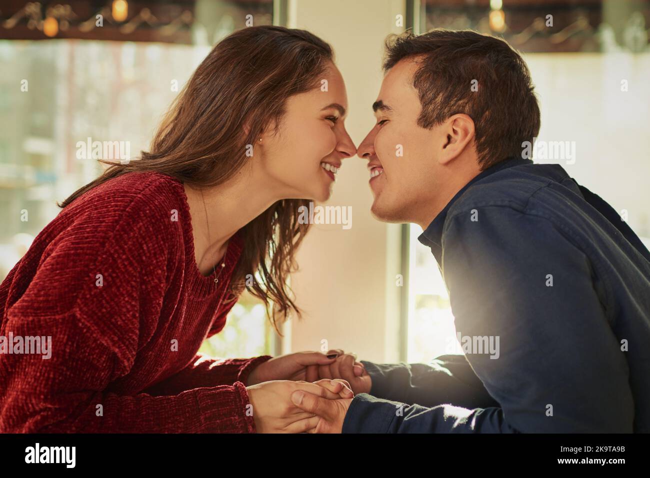 The very first kiss on the very first date. a young man and woman on a