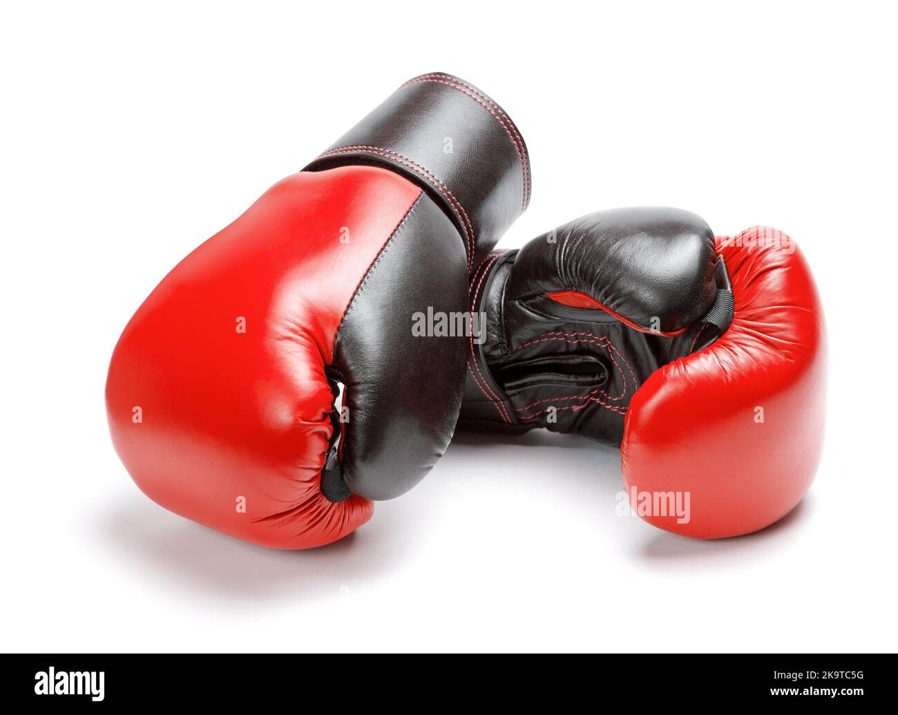 Red boxing gloves isolated on a white background. Stock Photo