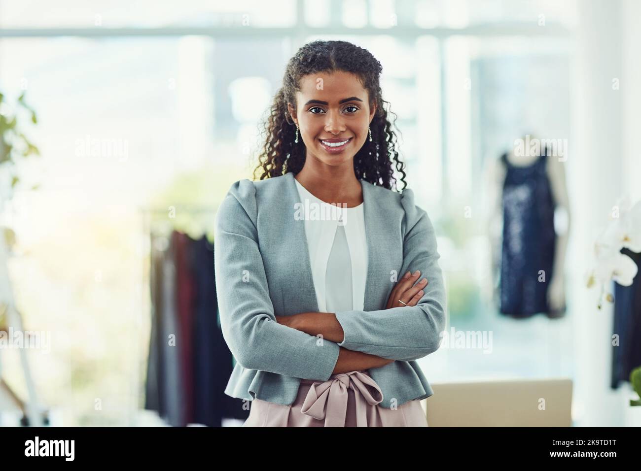 Proud of her successful clothing store. an attractive young business