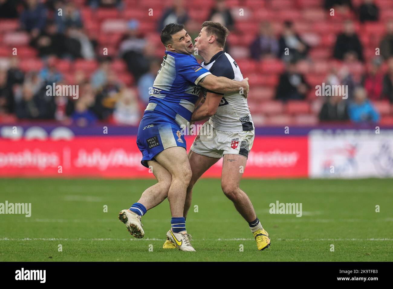 Jordan Meads of Greece and Williams of England clash during the