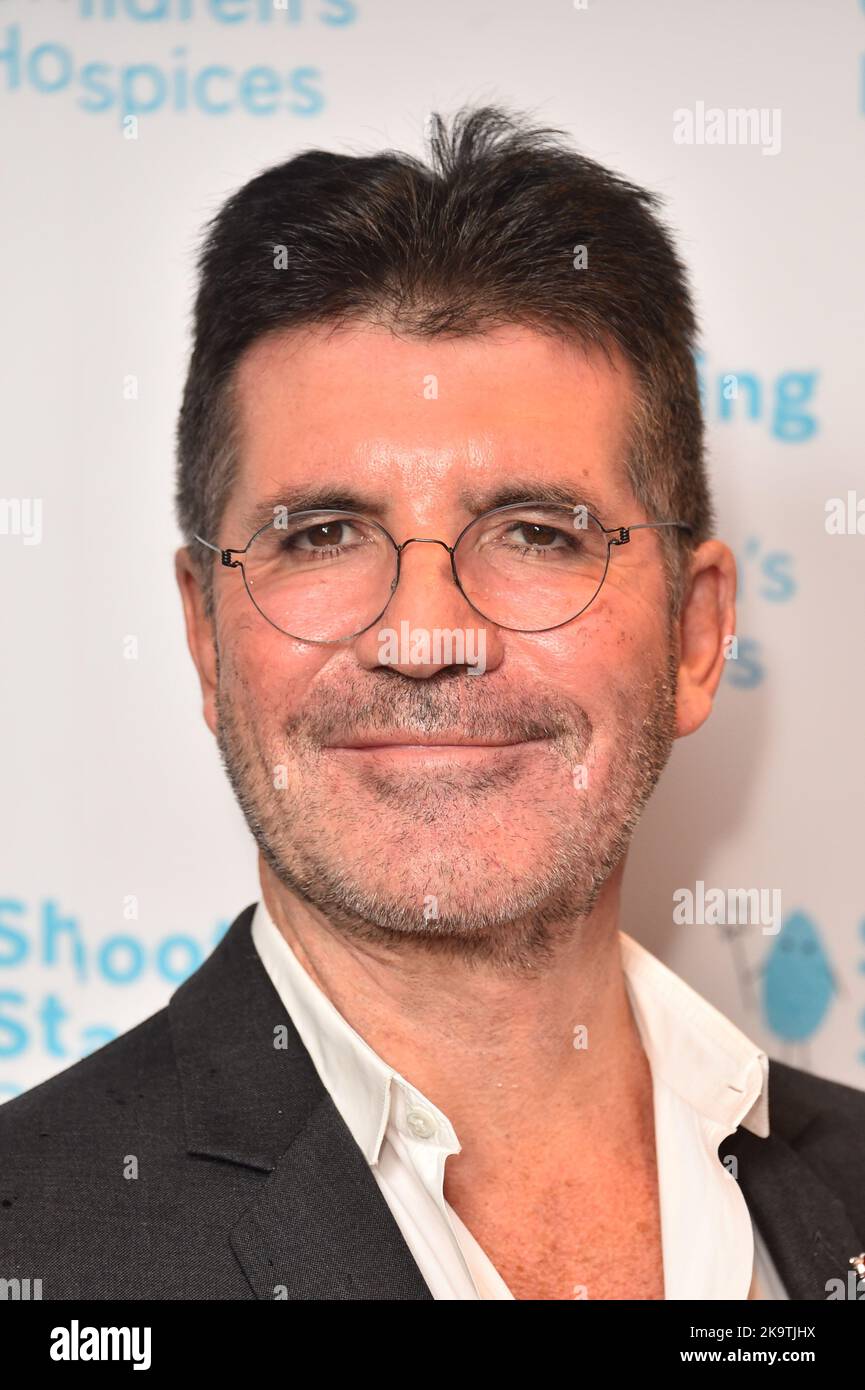 File photo dated 8/11/2019 of Simon Cowell who has admitted to being 'really unhappy' and working too much until his son was born eight years ago. The music mogul and TV personality behind Britain's Got Talent and The X-Factor said he was 'obsessed' with his work prior to the arrival of Eric, his son with fiancee Lauren Silverman. Issue date: Sunday October 30, 2022. Stock Photo