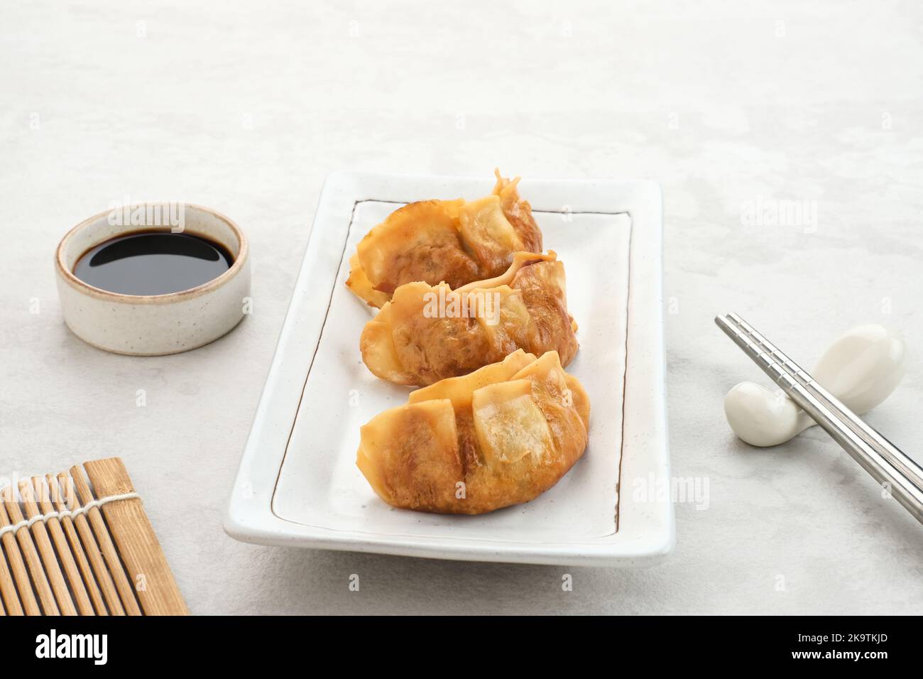 Gyoza, deep fried dumpling with juicy chicken and cabbage. Served in