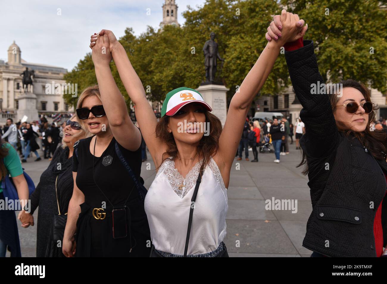 Protesters hold hands forming human chain during the demonstration ...