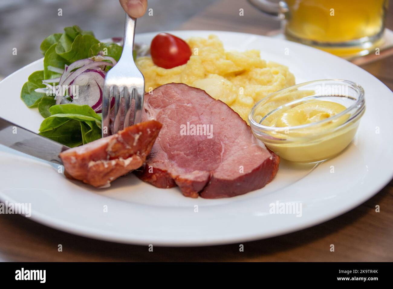 Black Forest Schaufele with potato salad, Martinsbräu Brewery and restaurant, Freiburg im Breisgau, Germany Stock Photo