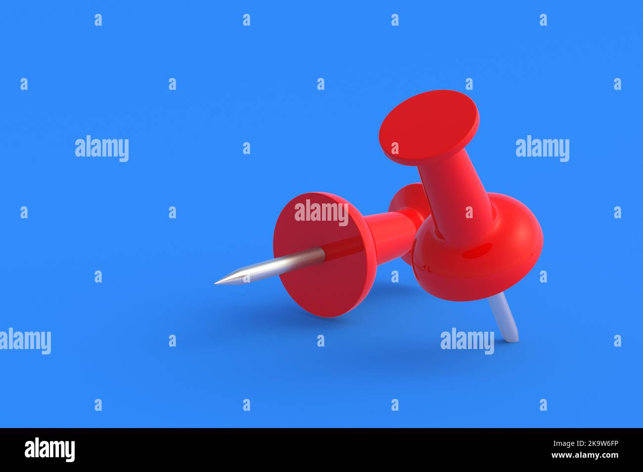Two push pins on blue background. Stationery tools. Office equipment ...