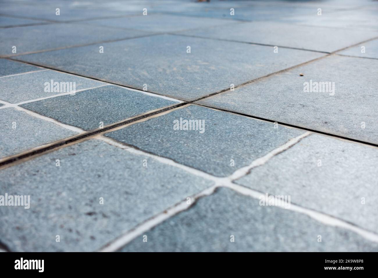 Outdoor rooftop tiles attached in symmetry with each other at right angle. India Stock Photo