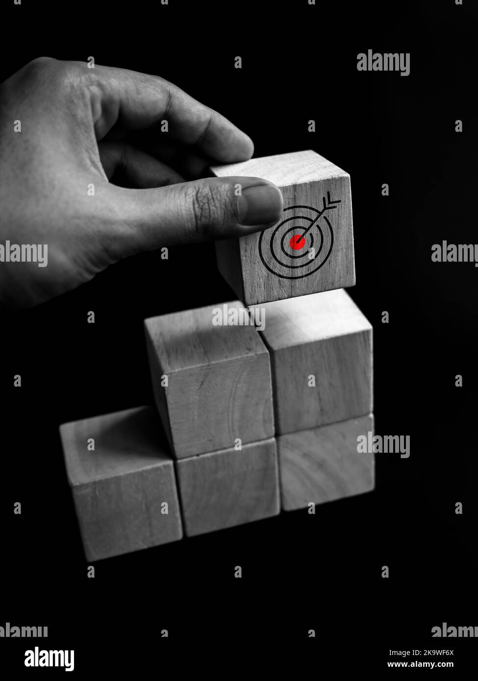 Close Up Target icon on the top of wooden cube block graph chart step ...