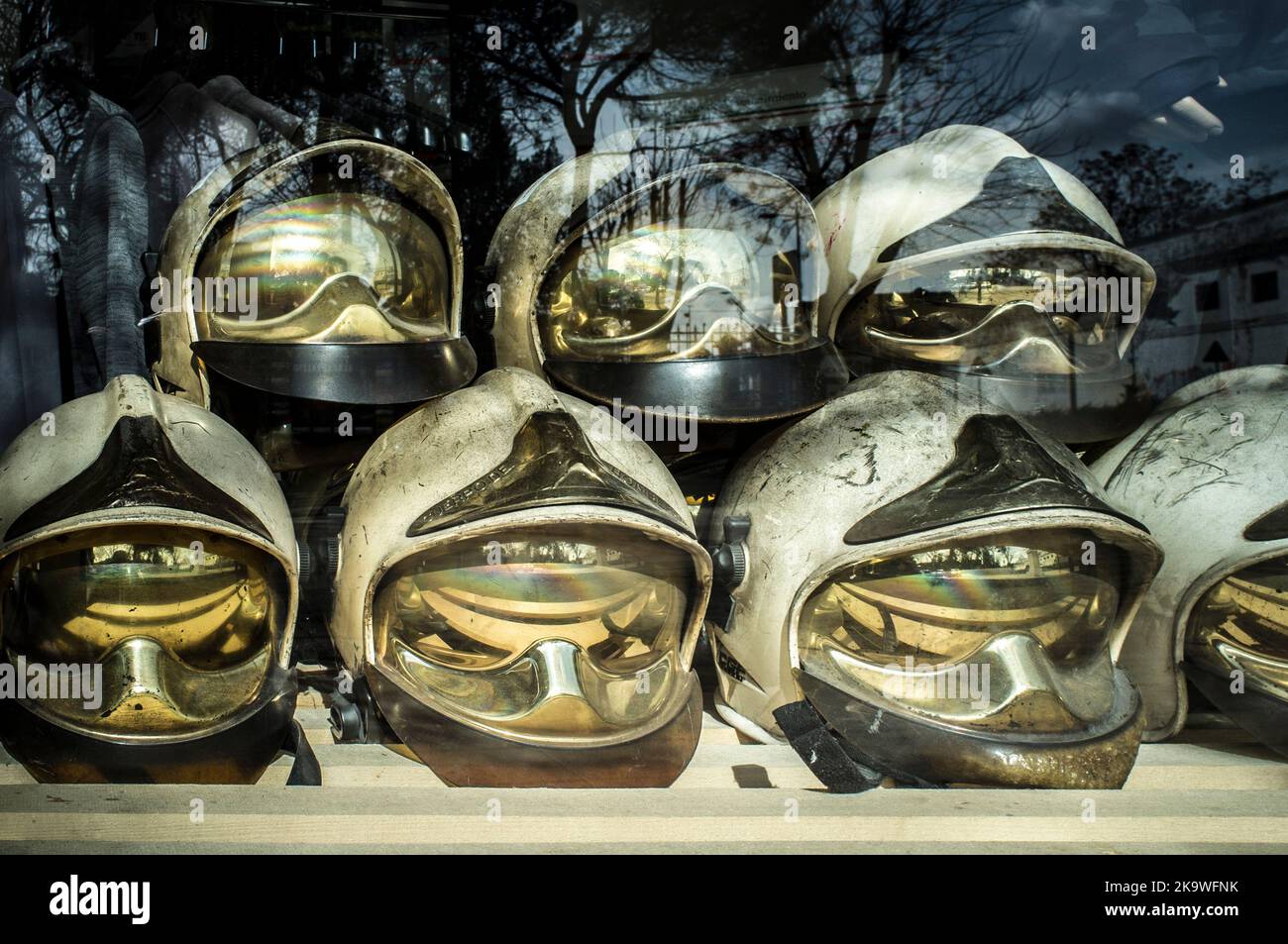 Pile of old firefighter helmets. Obsolete firefighter equipment Stock