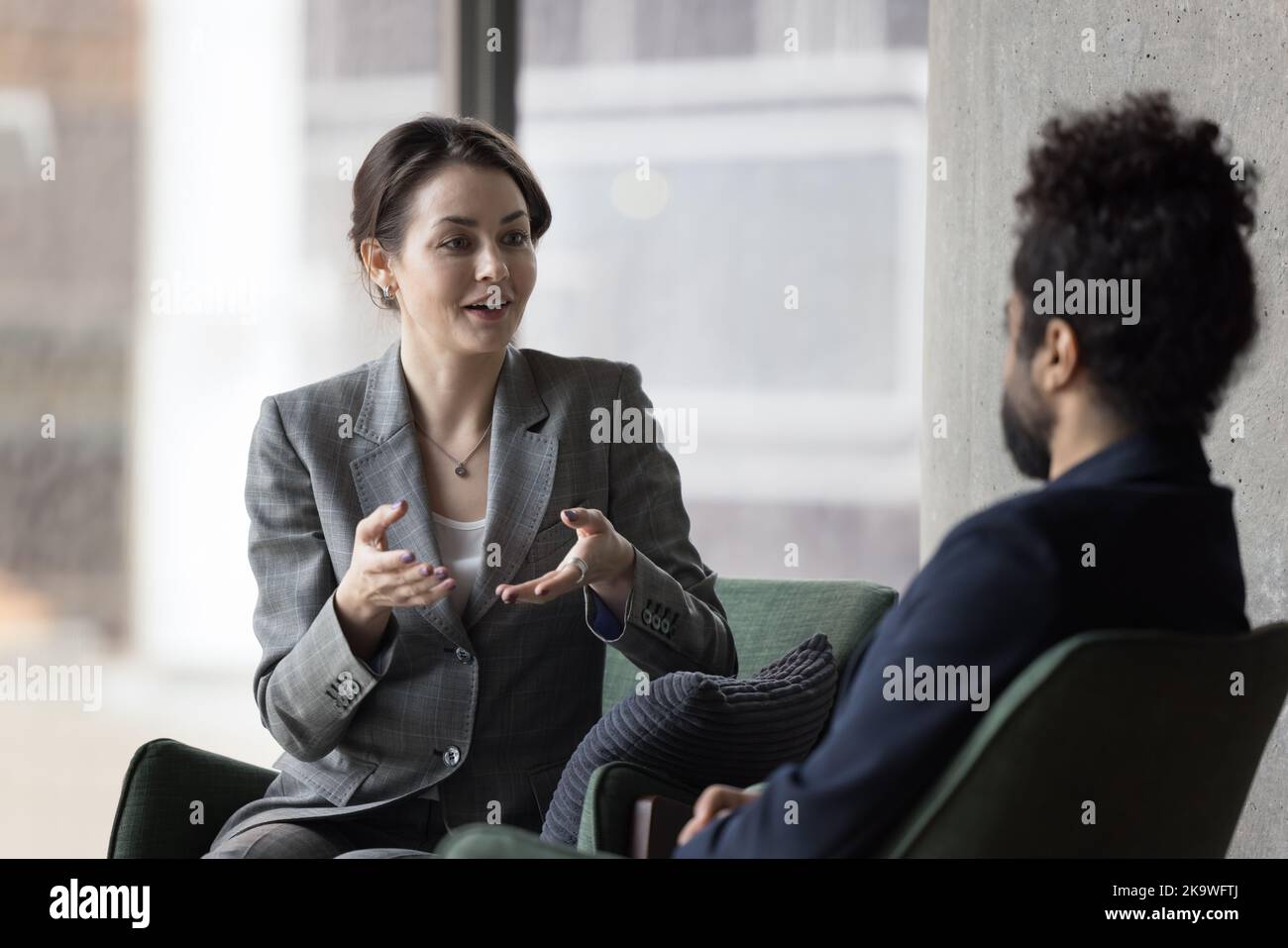 Dialogue of multi ethnic businesspeople in office Stock Photo