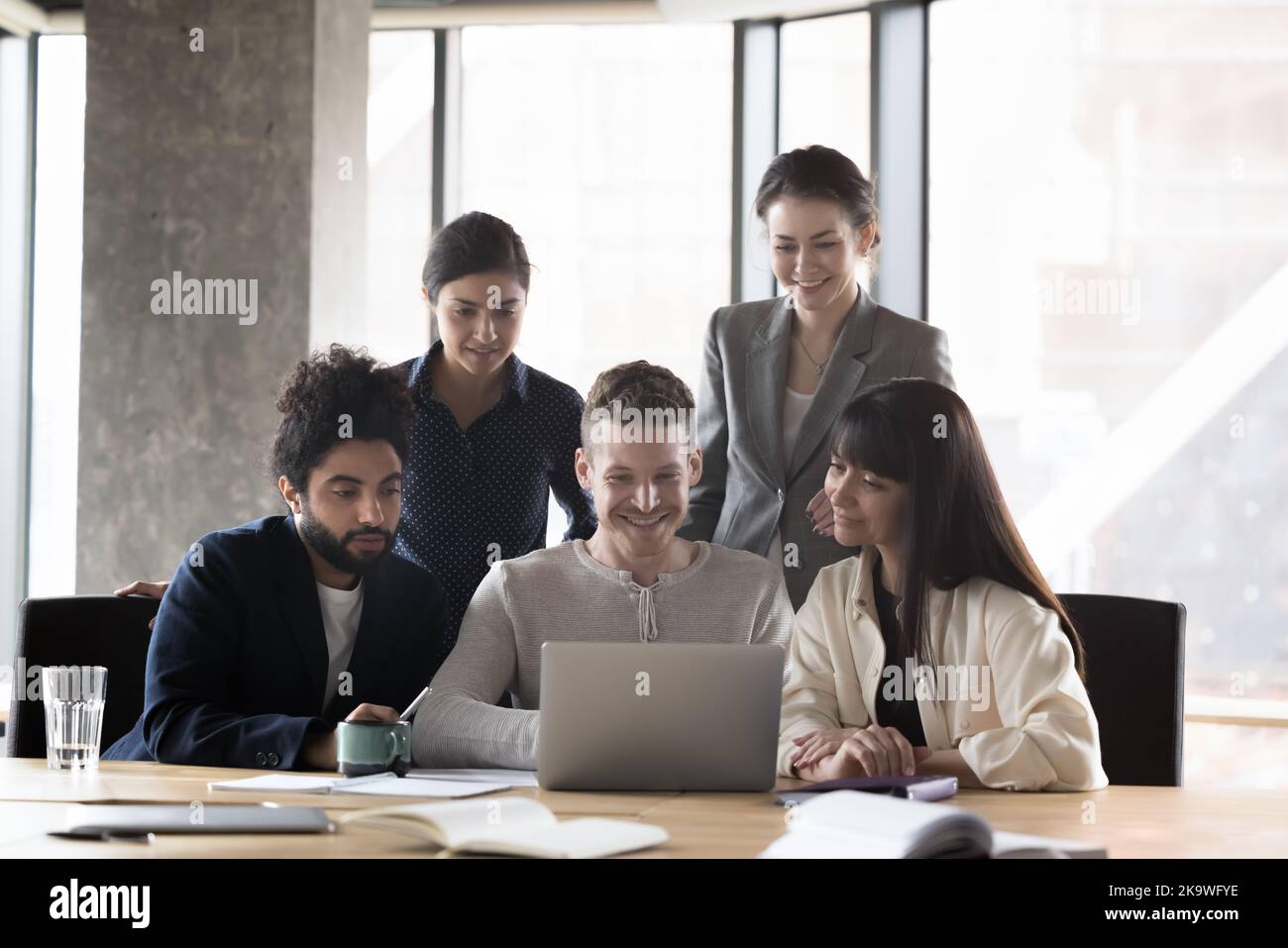 Group of multi ethnic businesspeople working together on laptop Stock Photo