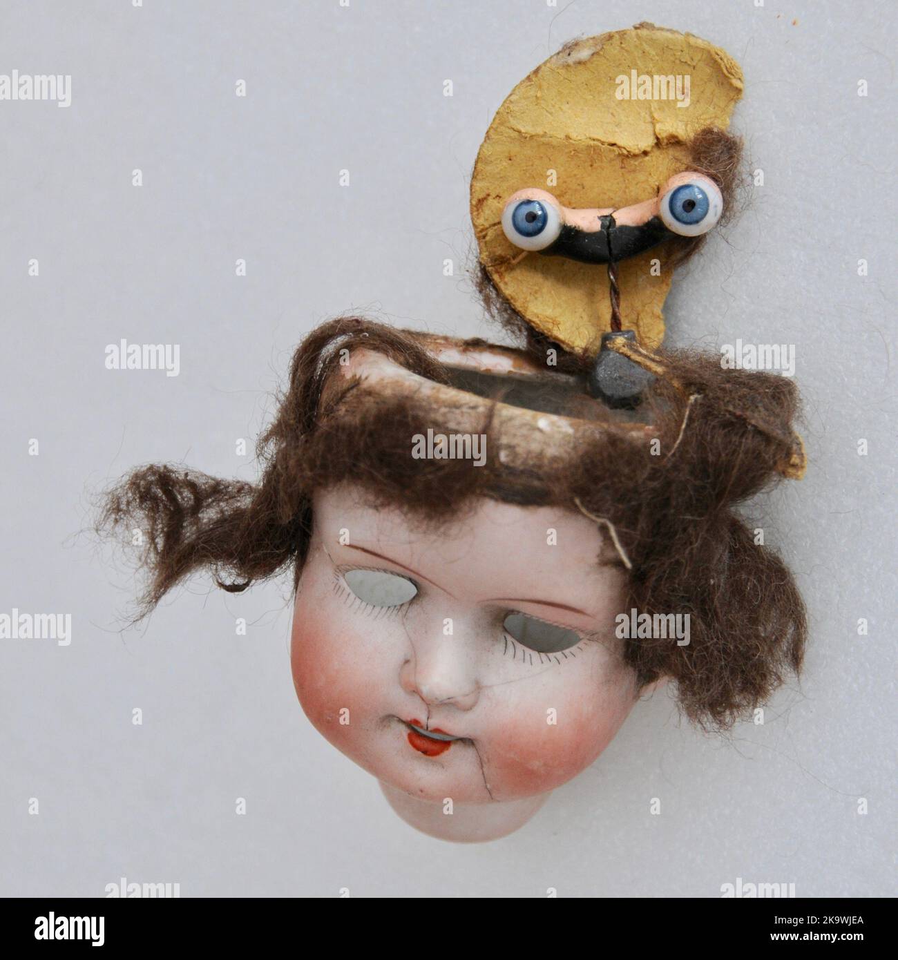 Scary vintage antique broken dolls head Stock Photo