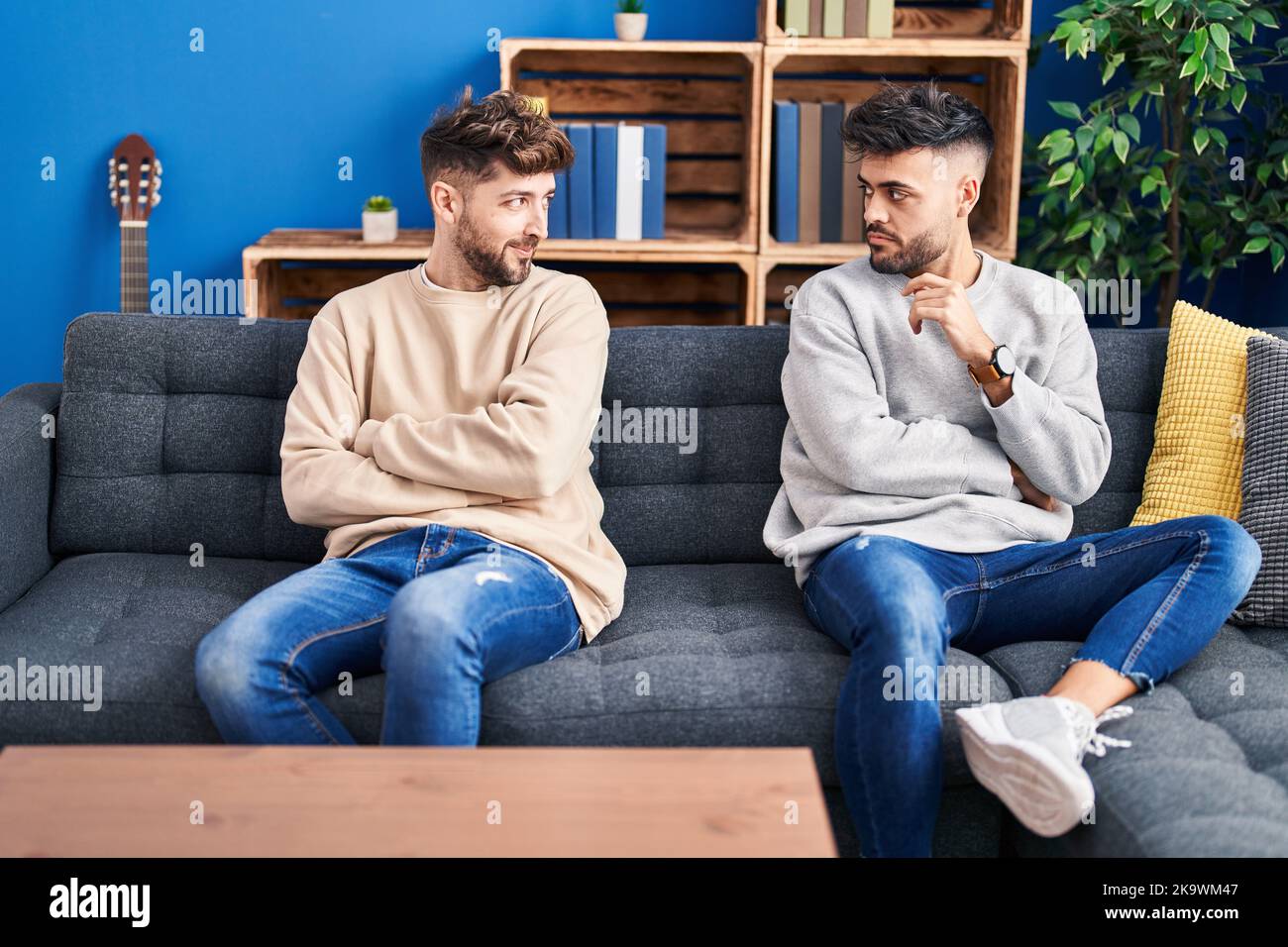 Young couple angry for disagreement sitting on sofa at home Stock Photo ...