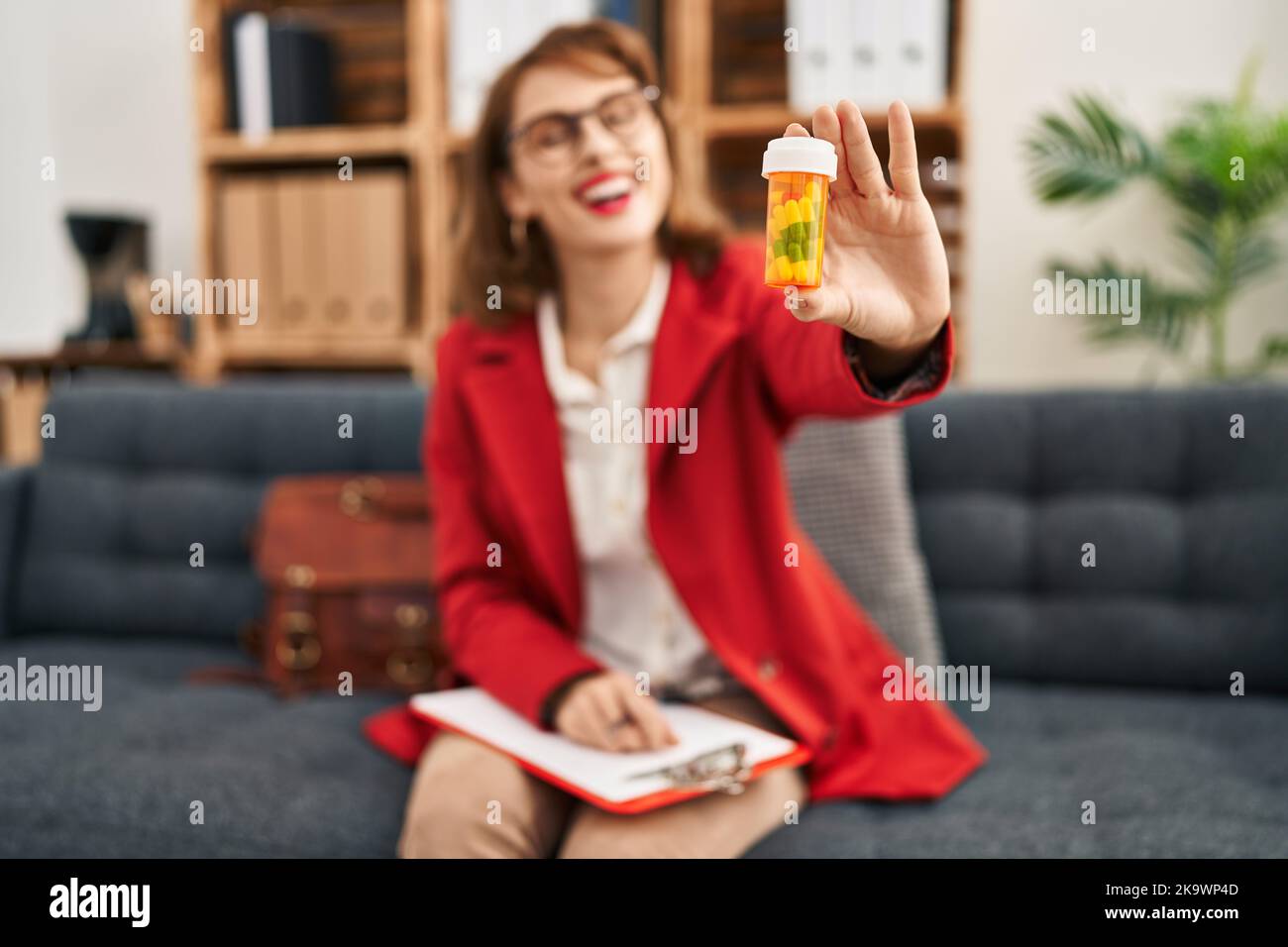 Young caucasian woman psychologist prescribe pills treatment at
