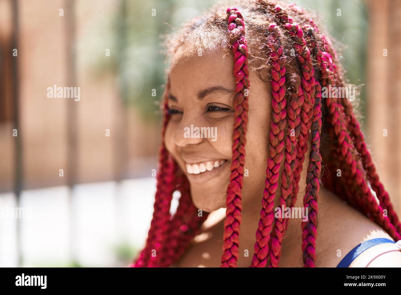 African american woman smiling confident looking to the side at street ...