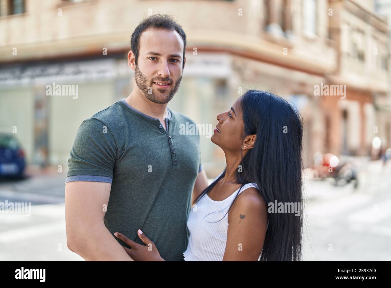 Man And Woman Interracial Couple Hugging Each Other At Street Stock