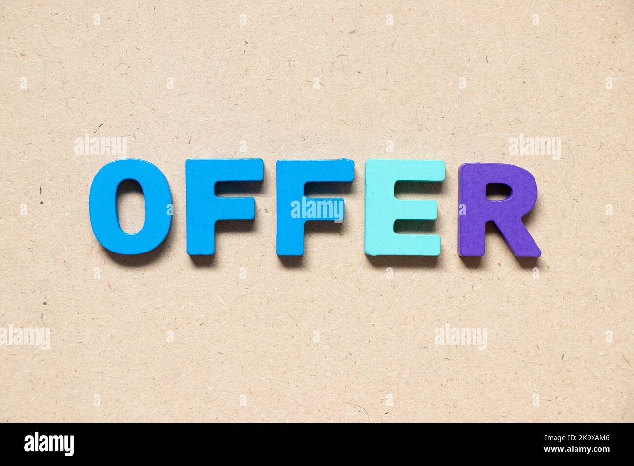 Color alphabet letter in word offer on wood background Stock Photo Alamy