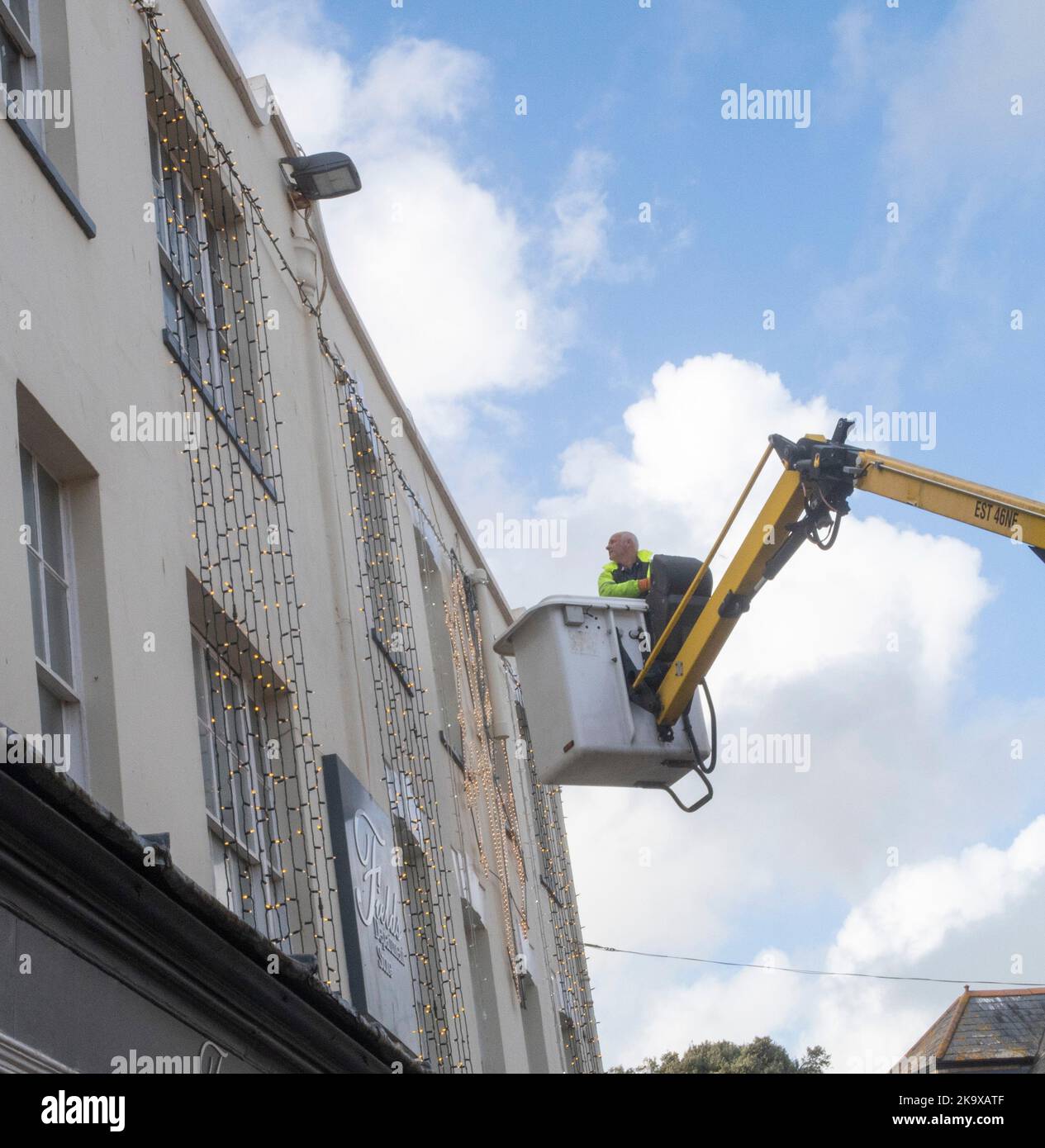 Sidmouth, Devon, 30th Oct 2022 Though not even November, contractors put up Christmas lights outside Fields department store in Sidmouth, Devon Tony Charnock/Alamy Live News Stock Photo