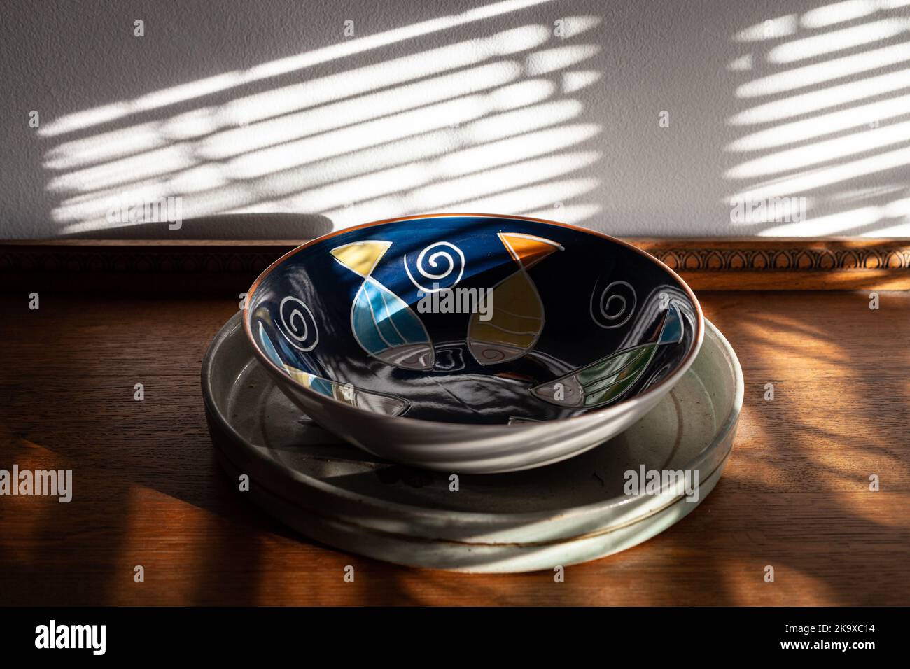 Colorful bowl on vintage drawer. Stock Photo