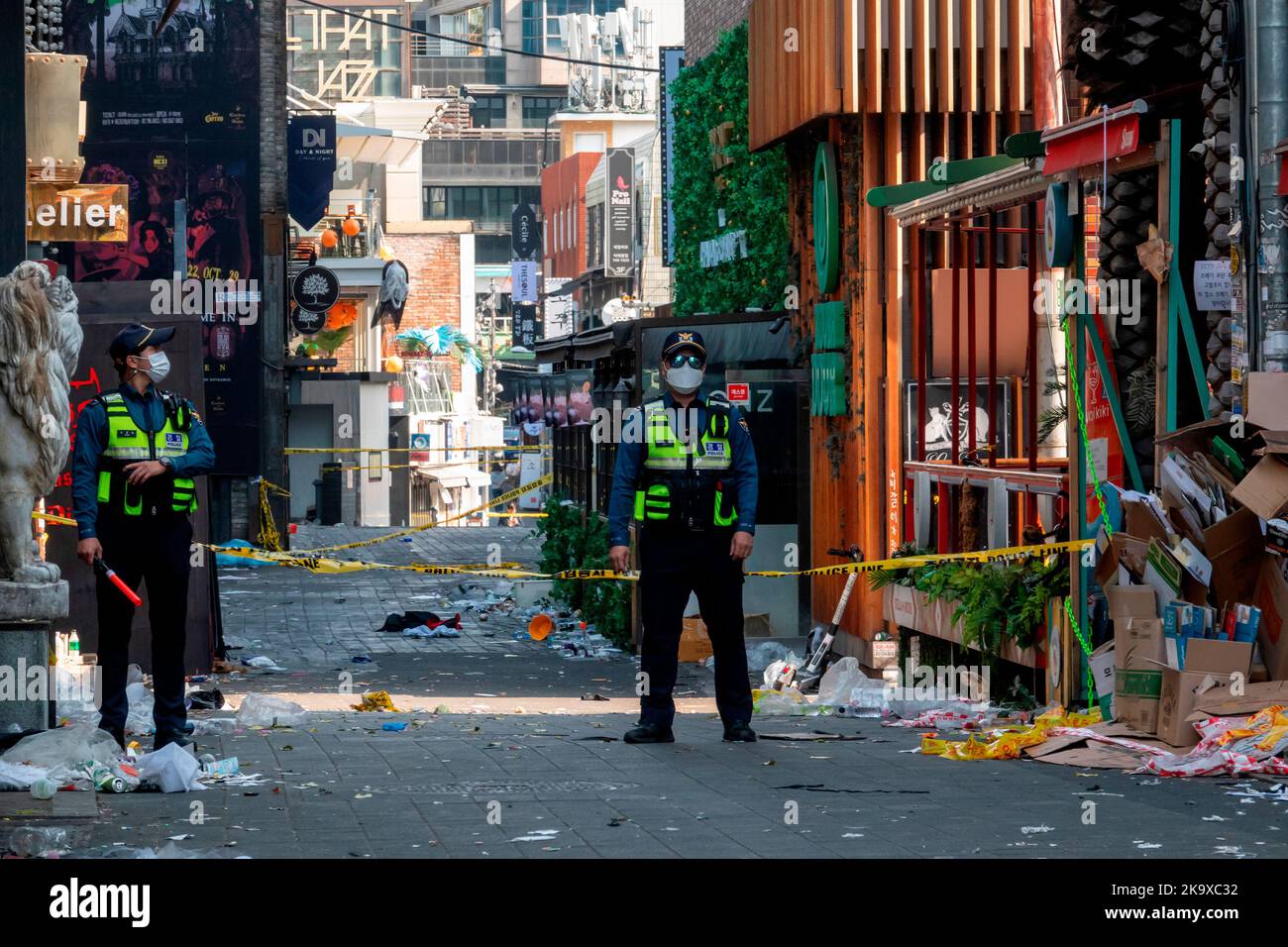 Seoul, South Korea. 30th Oct, 2022. Halloween tragedy in Seoul's Itaewon district, October 30, 2022 : Policemen stand guard at an alley in Itaewon district in Seoul, South Korea, where a stampede during Halloween parties killed people. At least 153 people have been killed and 133 others injured, many in their late teens and 20s, in a deadly stampede in a narrow downhill alley near Hamilton Hotel in Itaewon after tens of thousands of people visited the area for Halloween Saturday night. Credit: Lee Jae-Won/AFLO/Alamy Live News Credit: Aflo Co. Ltd./Alamy Live News Stock Photo