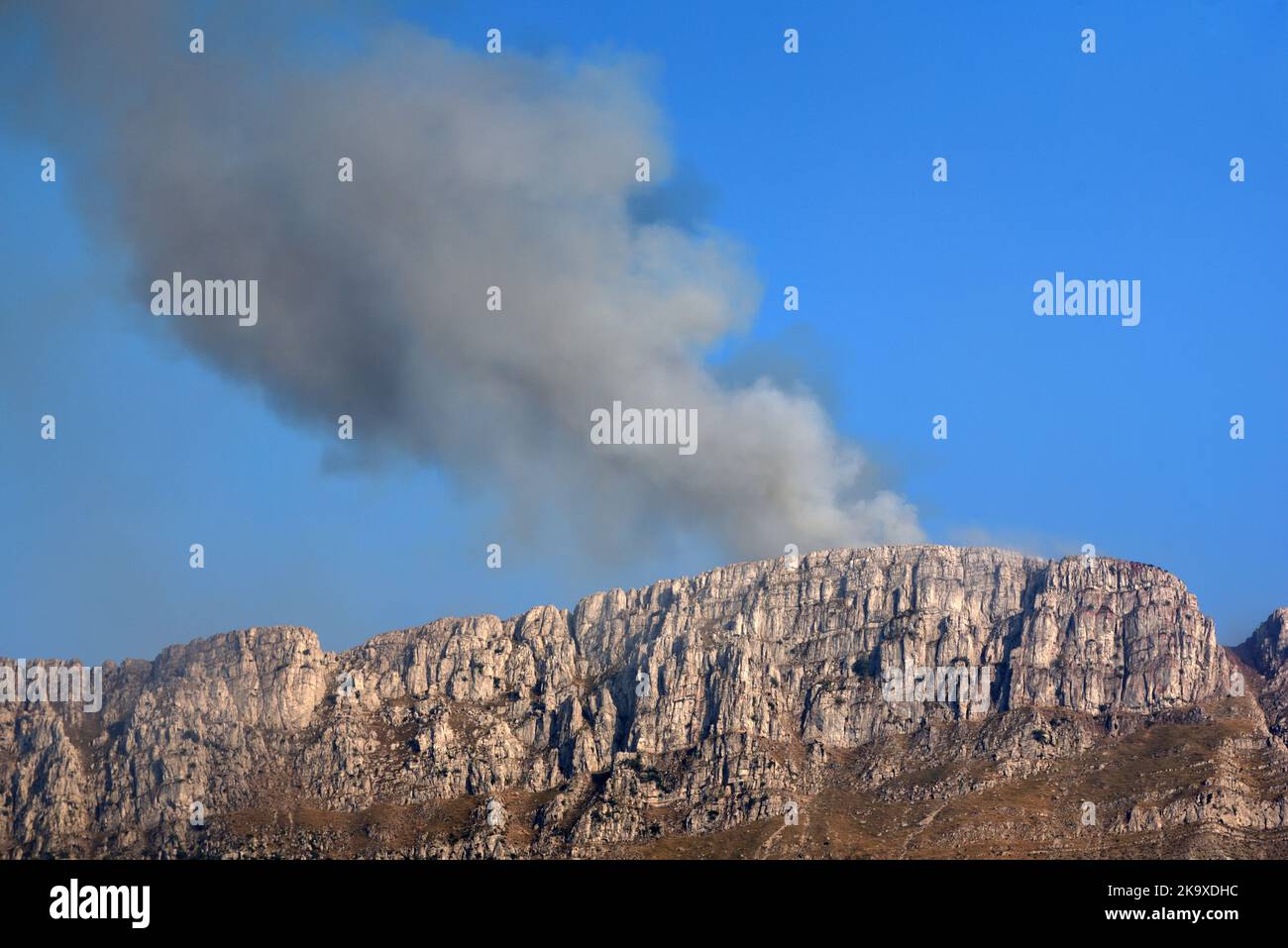 Smoke of Wild Fire, Bush Fire or Forest Fire Burning on Mountain Ridge of Les Traversières in the Verdon Lower Alps Alpes-de-Haute-Provence France Stock Photo