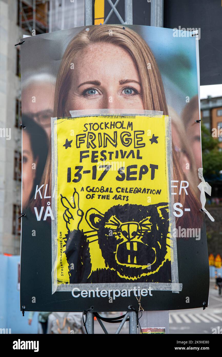 Stockholm Fringe Festival poster on Centerpartiet campaign poster in Stockholm, Sweden Stock Photo