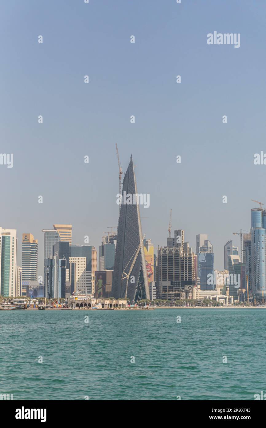 The skyline of the modern and high-rising city of Doha in Qatar, Middle East. Doha's Corniche in West Bay. Stock Photo