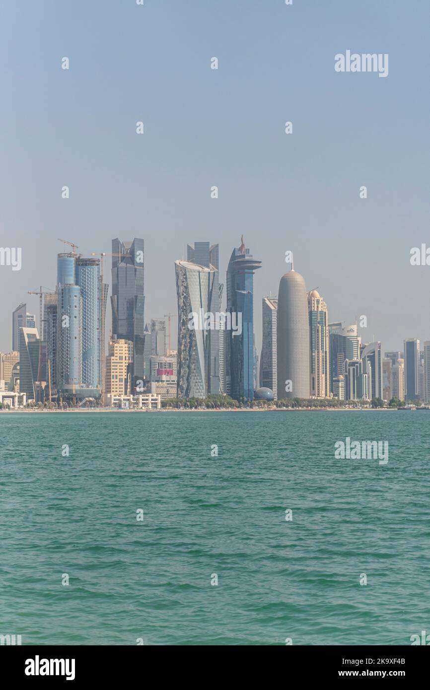 The skyline of the modern and high-rising city of Doha in Qatar, Middle East. Doha's Corniche in West Bay. Stock Photo