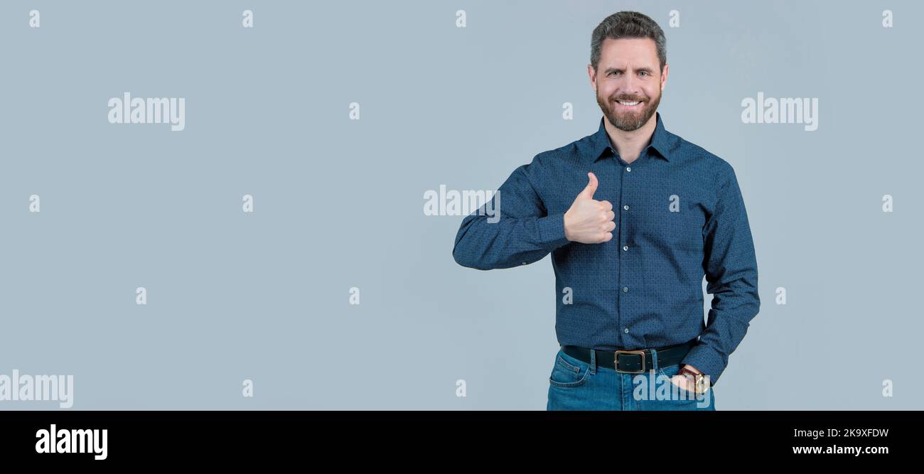 Showing approval or satisfaction. Happy man give thumbs up. Approval concept. Man face portrait, banner with copy space. Stock Photo